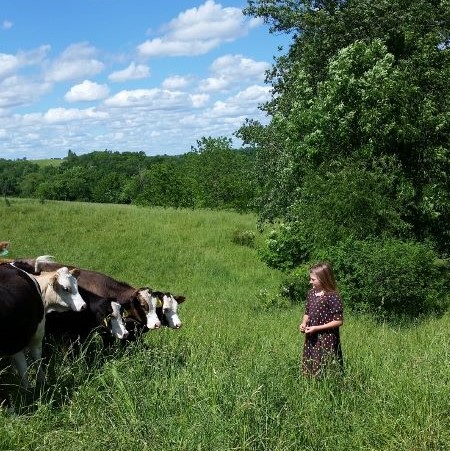 girl in field with cows.jpg